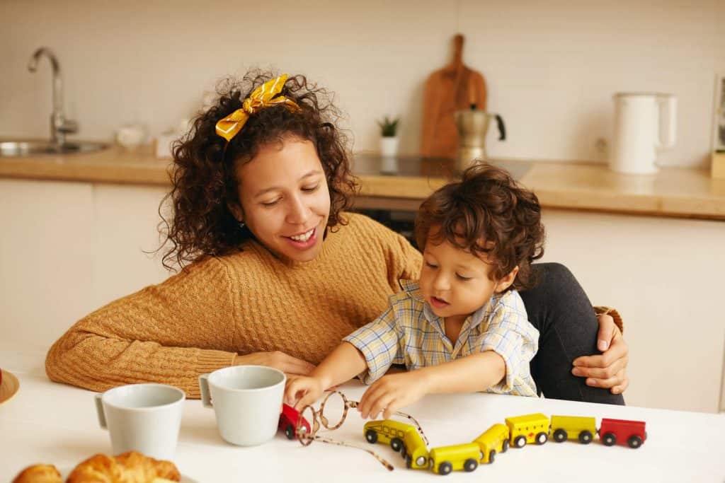 Mum and boy playing trains